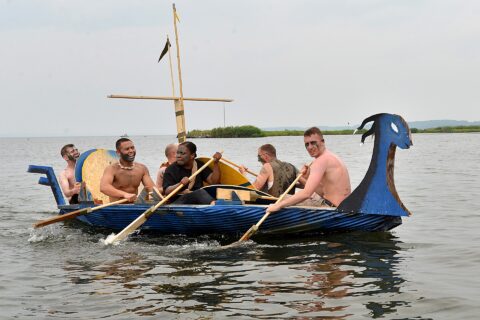 Sailors from Naval Air Facility Misawa Security Department take part in the 2013 Navy Misawa Boat Regatta, Aug. 16, 2013. Naval Air Facility Misawa organizes this annual event with each team tasked with building a vessel