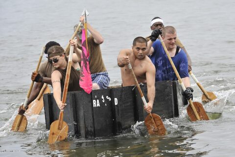Sailors from Aircraft Intermediate Maintenance Detachment Misawa’s 900 Division take part in the 2013 Navy Misawa Boat Regatta, Aug. 16, 2013. Naval Air Facility Misawa organizes this annual event with each team tasked w