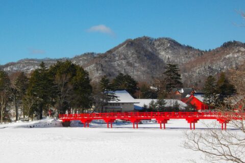 Akagi Shrine on the frozen Lake Oono, of Akagi Mountains, Gunma, Japan.
