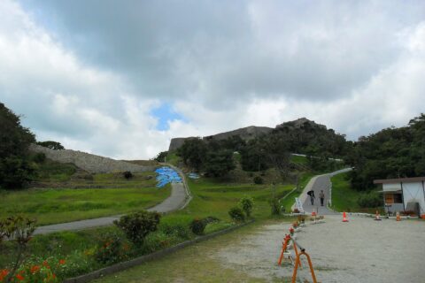 At the foot of the castle.