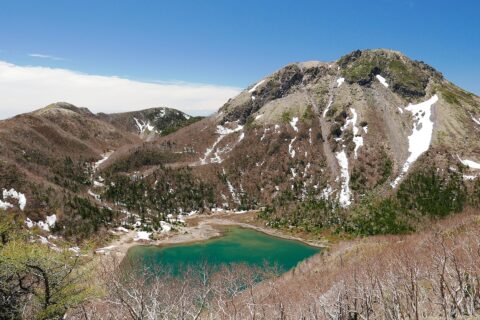 The northeast face of Mount Nikko-Shirane's lava dome. Goshiki pond in the foreground.