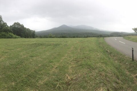 Route 103 entrance to Towada-Hachimantai National Park with the Hakkōda Mountains in the background