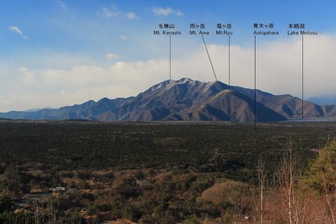 Tenshi Mountains, Lake Motosu and Aokigahara seen from Koyodai on Mount Ashiwada in Japan.