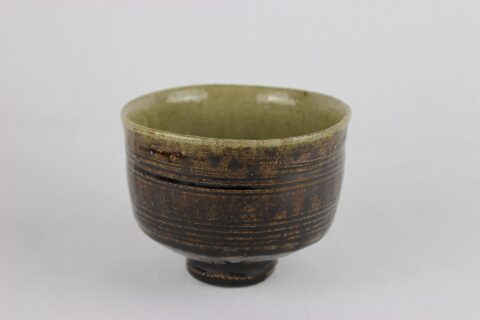 Ame glazed tea bowl with combed band around exterior. From the W.A. Ismay Studio Ceramics Collection at York Art Gallery
