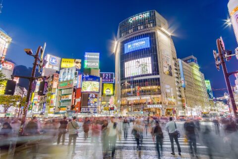 Pedestrians crossing perhaps the most famous scramble intersection in the world, in Shibuya, Tokyo, Japan. Taken from Hachikō square.