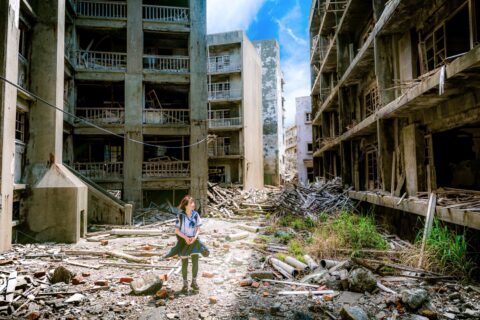 A student exploring Hashima Island in Japan